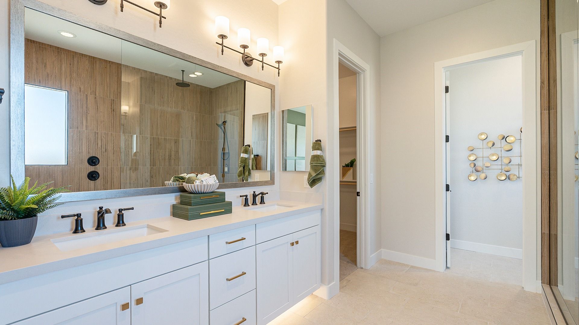 Experience elevated style with sleek wood paneling and ambient lighting in Hacienda at Estrella's bathroom.