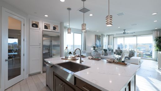 Luxurious marble countertops and expansive windows define elegance at The Villas at Mystic.