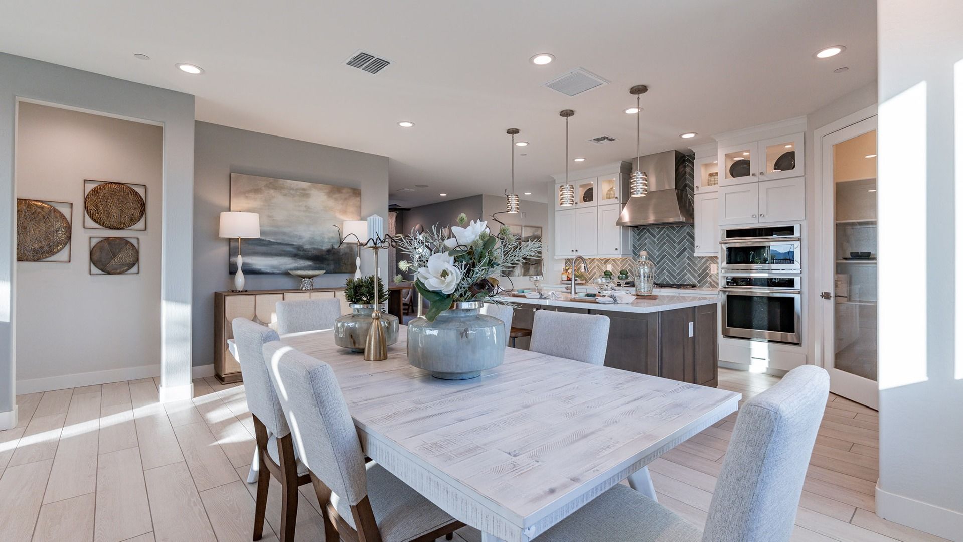 Revel in elegant design with bespoke cabinetry and chic pendant lighting at The Villas at Mystic.