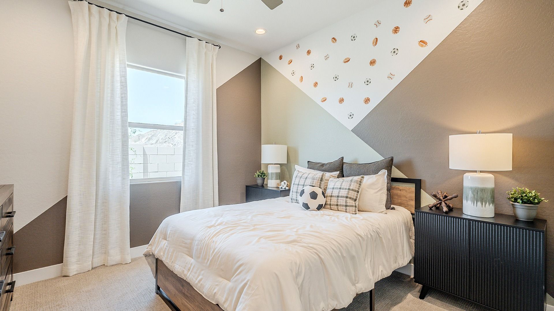 Sophisticated geometric wall design elevates this Hacienda at Estrella bedroom, featuring high-quality finishes.