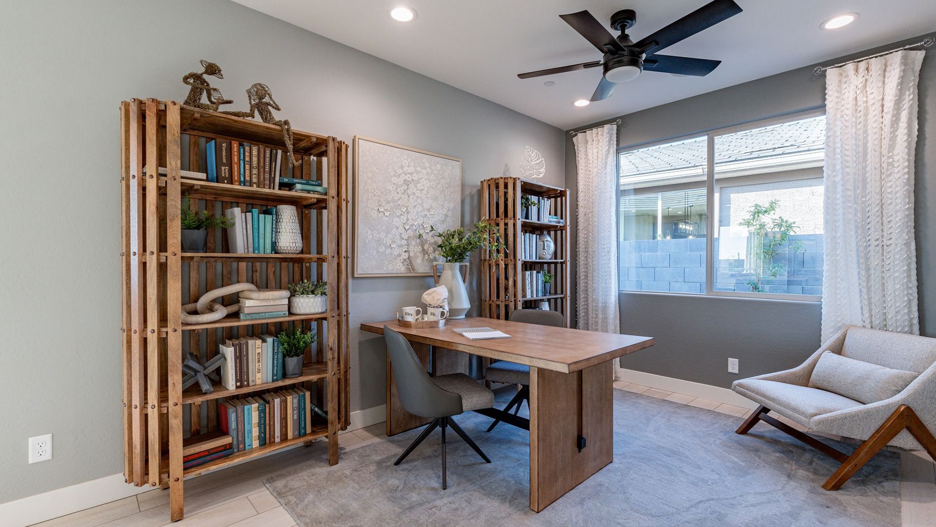 Luxurious wooden elements and airy design define this serene home office in The Villas at Mystic, Arizona.