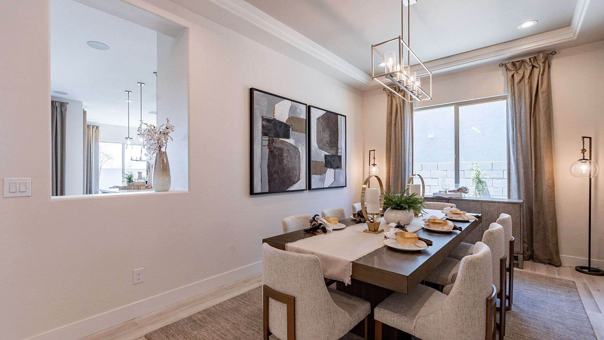 Experience elevated dining with chic lighting, abstract art, and refined furnishings in Windrose.