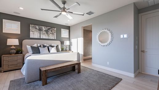 Discover refined elegance with sleek finishes and unique decor in this Villas at Mystic bedroom.