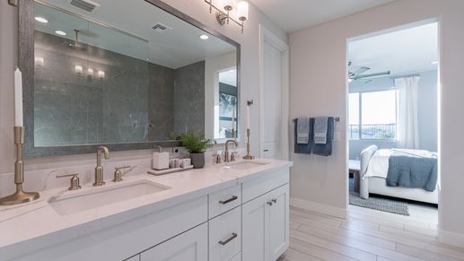Featuring marble countertops and exquisite fixtures, this bathroom exudes luxury at The Villas at Mystic.