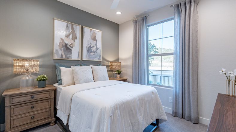 Discover serene elegance at Mystic Villas, featuring chic art, tasteful wood furnishings, and expansive window vistas.