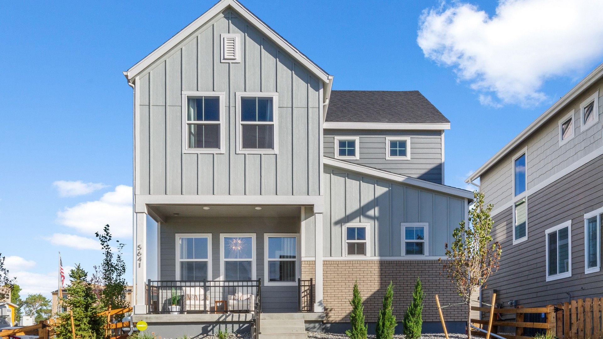 Discover elegance at Dillon Pointe with gable roofing, an inviting porch, and serene luxury living.