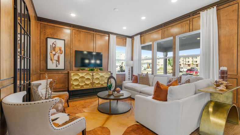 Experience refined elegance with rich wood paneling and stylish gold accents at Dillon Pointe.