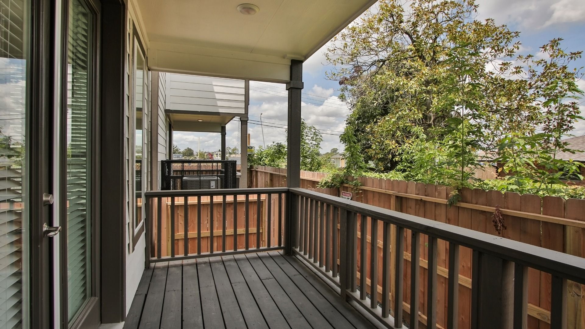 Elegant  balcony defines this exquisite Houston home in Independence Heights.