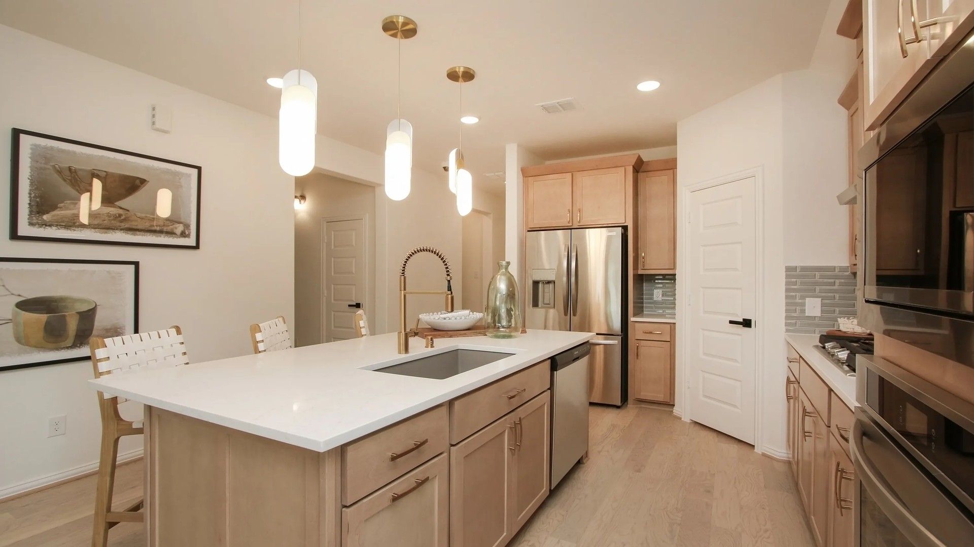 Luxurious kitchen with quartz countertops, custom cabinetry, stainless steel appliances in Ellis Cove.