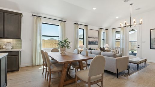 Experience elegance with soaring ceilings and sleek lighting in Oakwood Estates' living area.