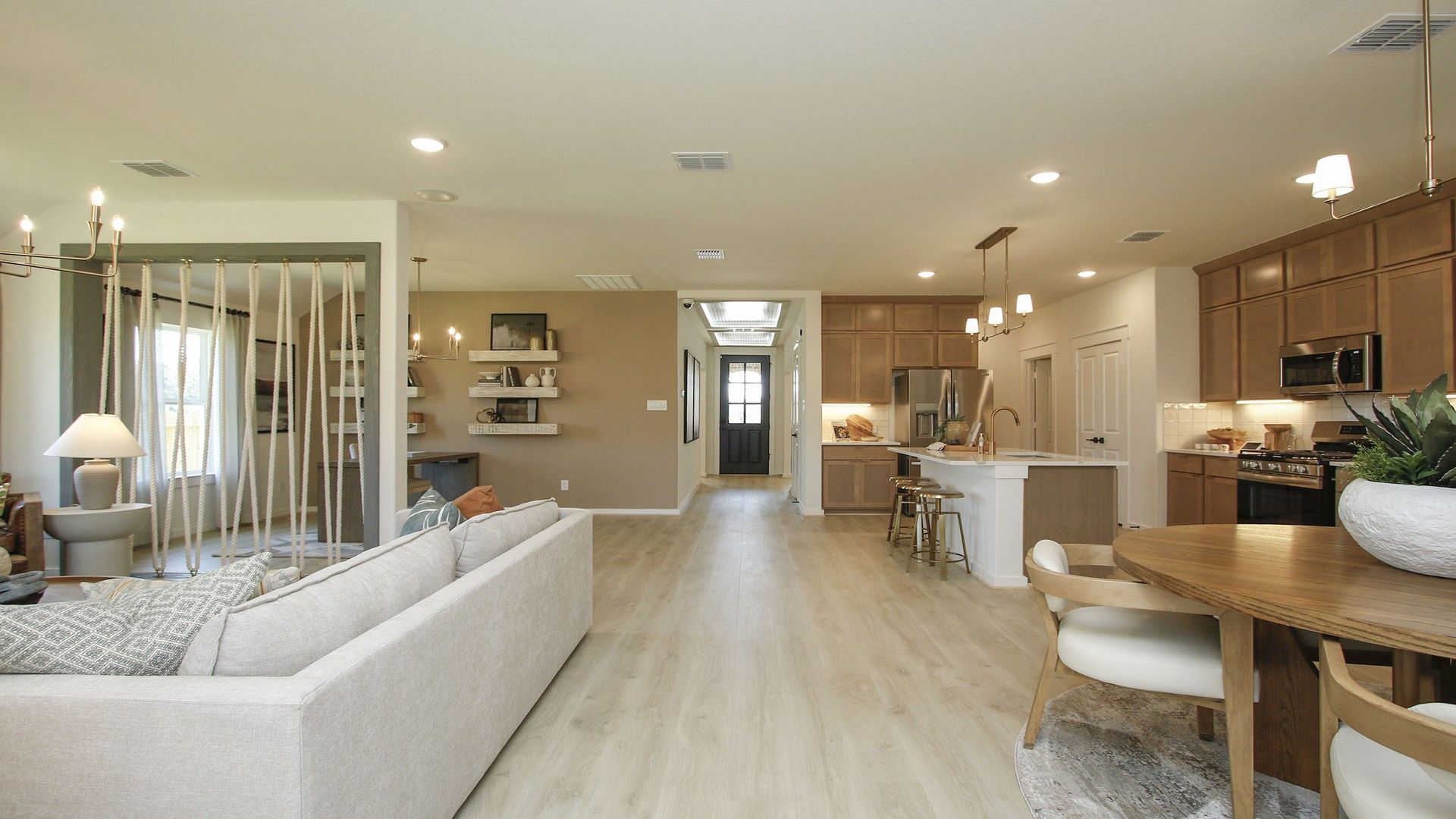 Discover elegant wood flooring and sophisticated light fixtures in Cielo's luxurious open-plan interior.