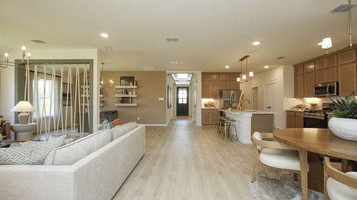 Discover elegant wood flooring and sophisticated light fixtures in Cielo's luxurious open-plan interior.