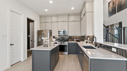 Experience luxury with elegant cabinetry and exquisite marble countertops in Park at Eldridge, Houston.