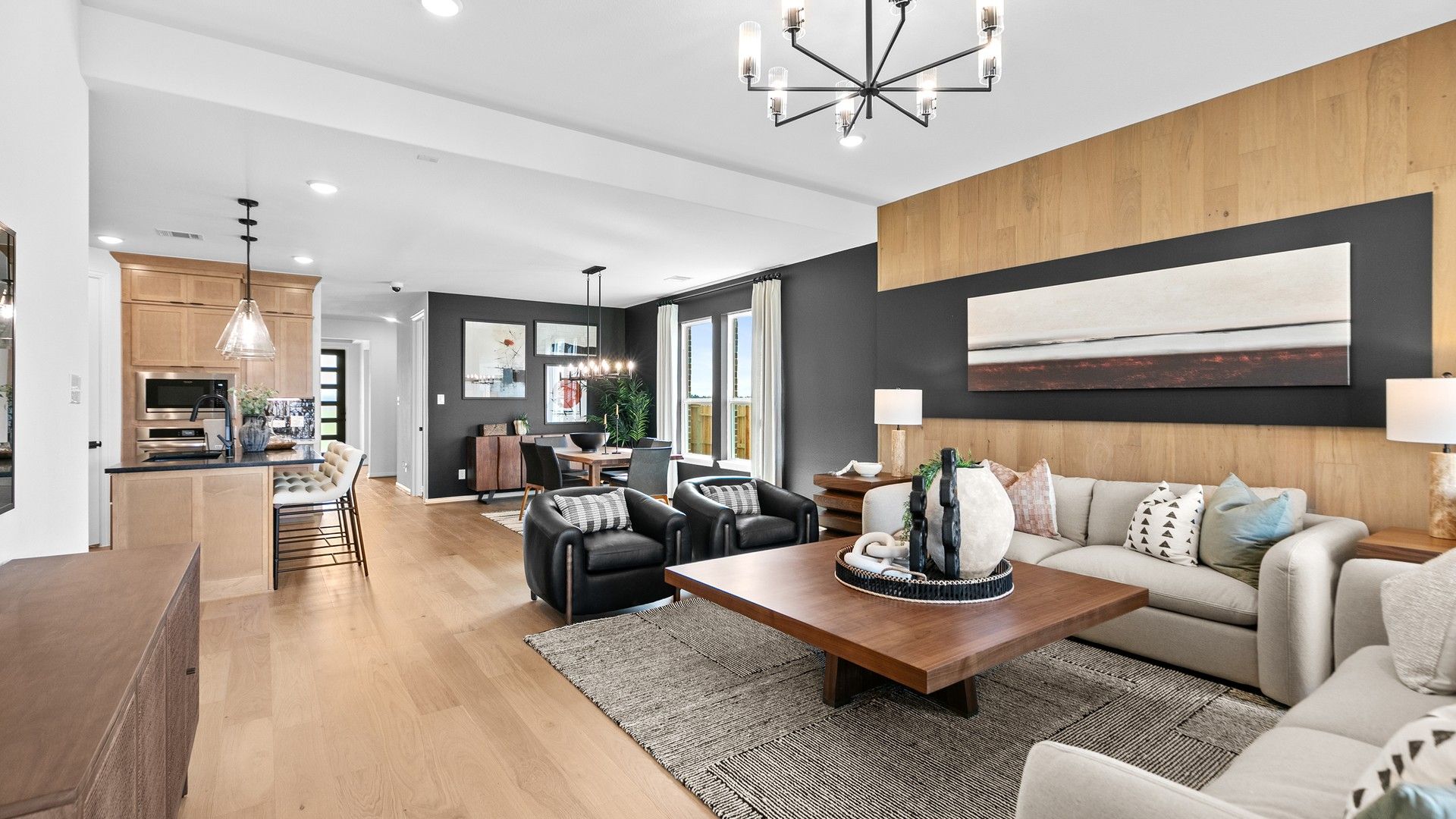 Experience sophistication with wood paneling, designer lighting, and an airy open plan in River Ranch.