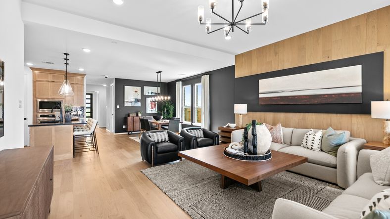 Experience sophistication with wood paneling, designer lighting, and an airy open plan in River Ranch.