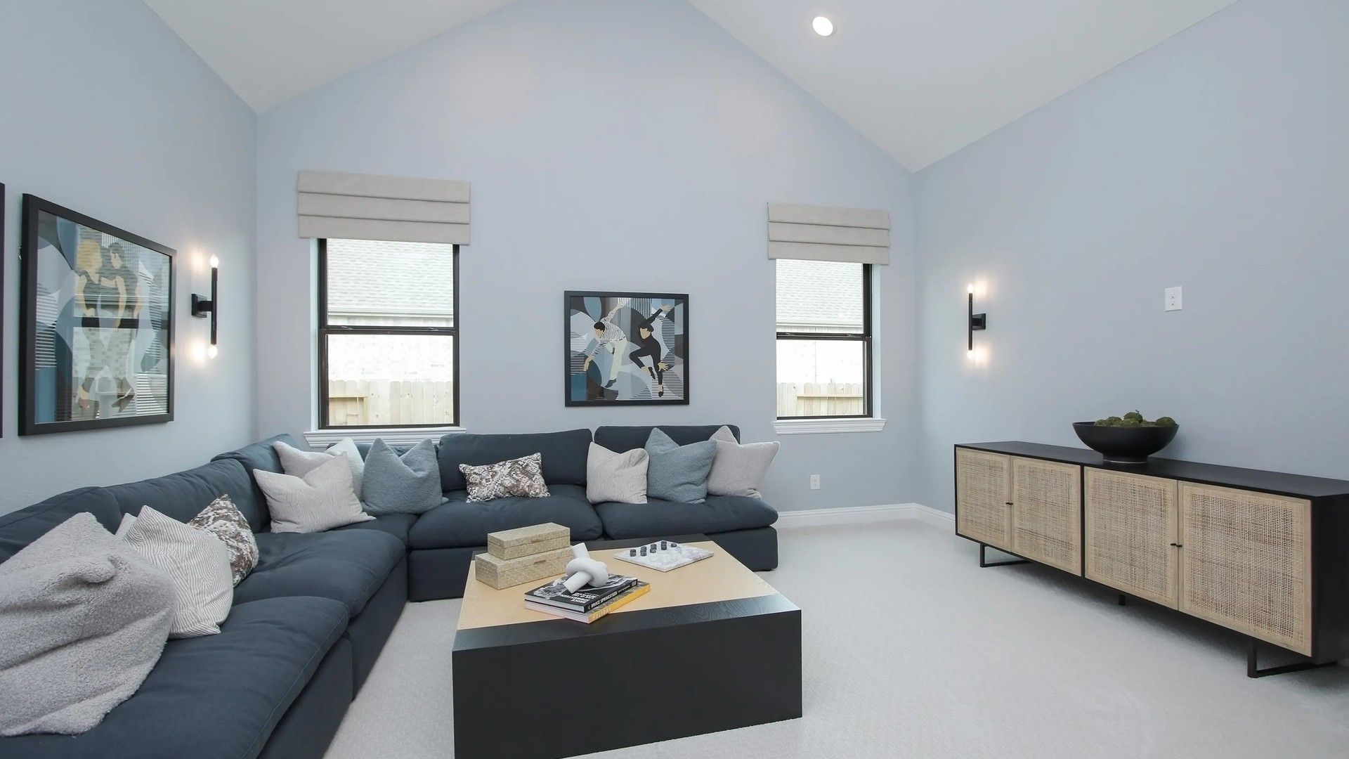 Sophisticated vaulted ceilings and bespoke furnishings define this exquisite Coastal Point living area.