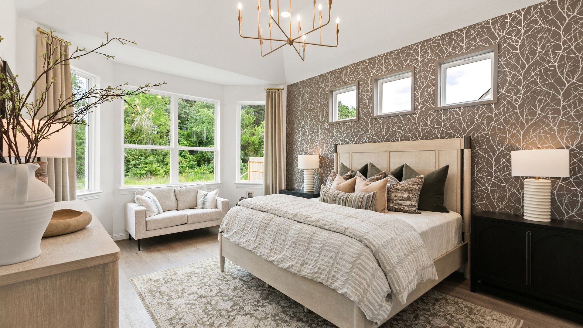 Experience refined living with designer wallpaper and a chic chandelier in Katy Lakes's exquisite bedroom.
