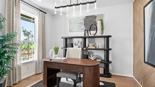 Luxurious River Ranch office with designer lighting, bespoke wooden elements, and elegant open shelving.