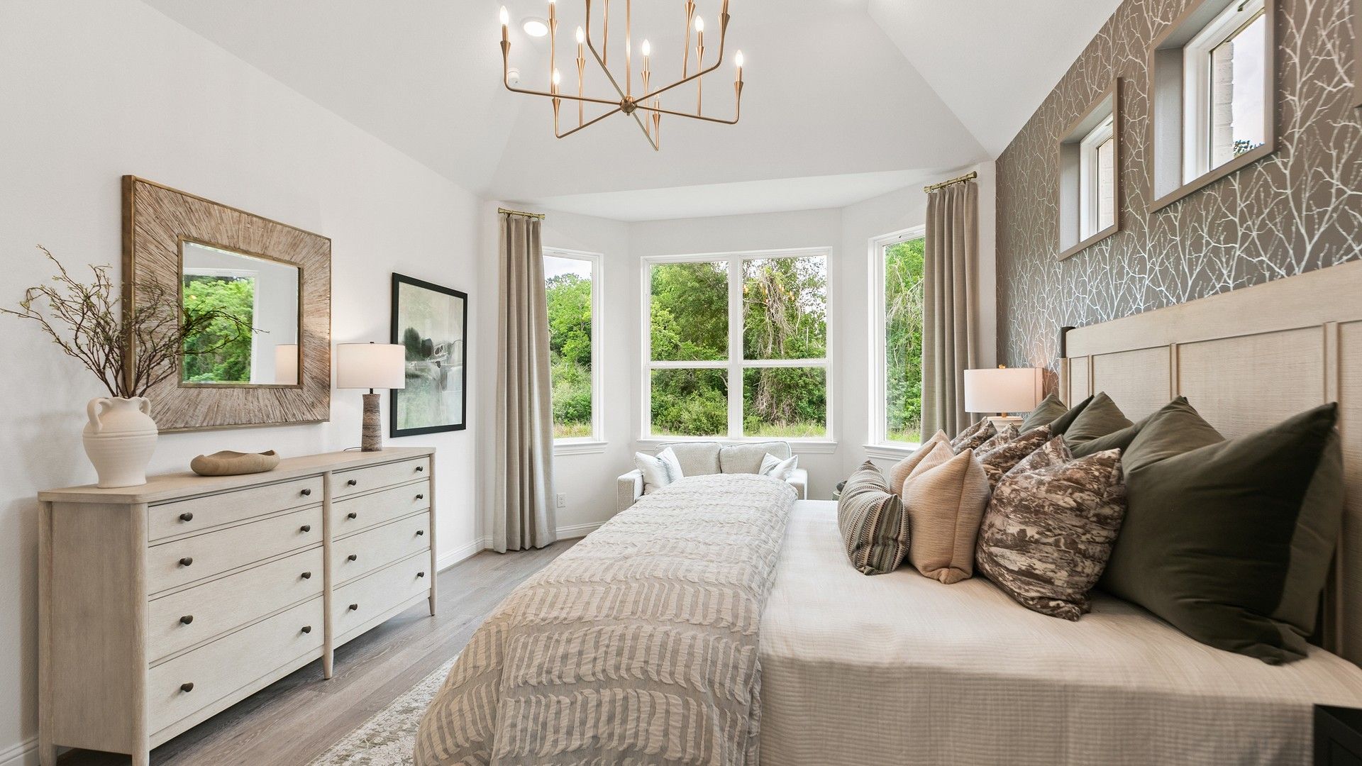 Experience opulent design with grand windows, a modern chandelier, and bespoke wallpaper in Katy Lakes.
