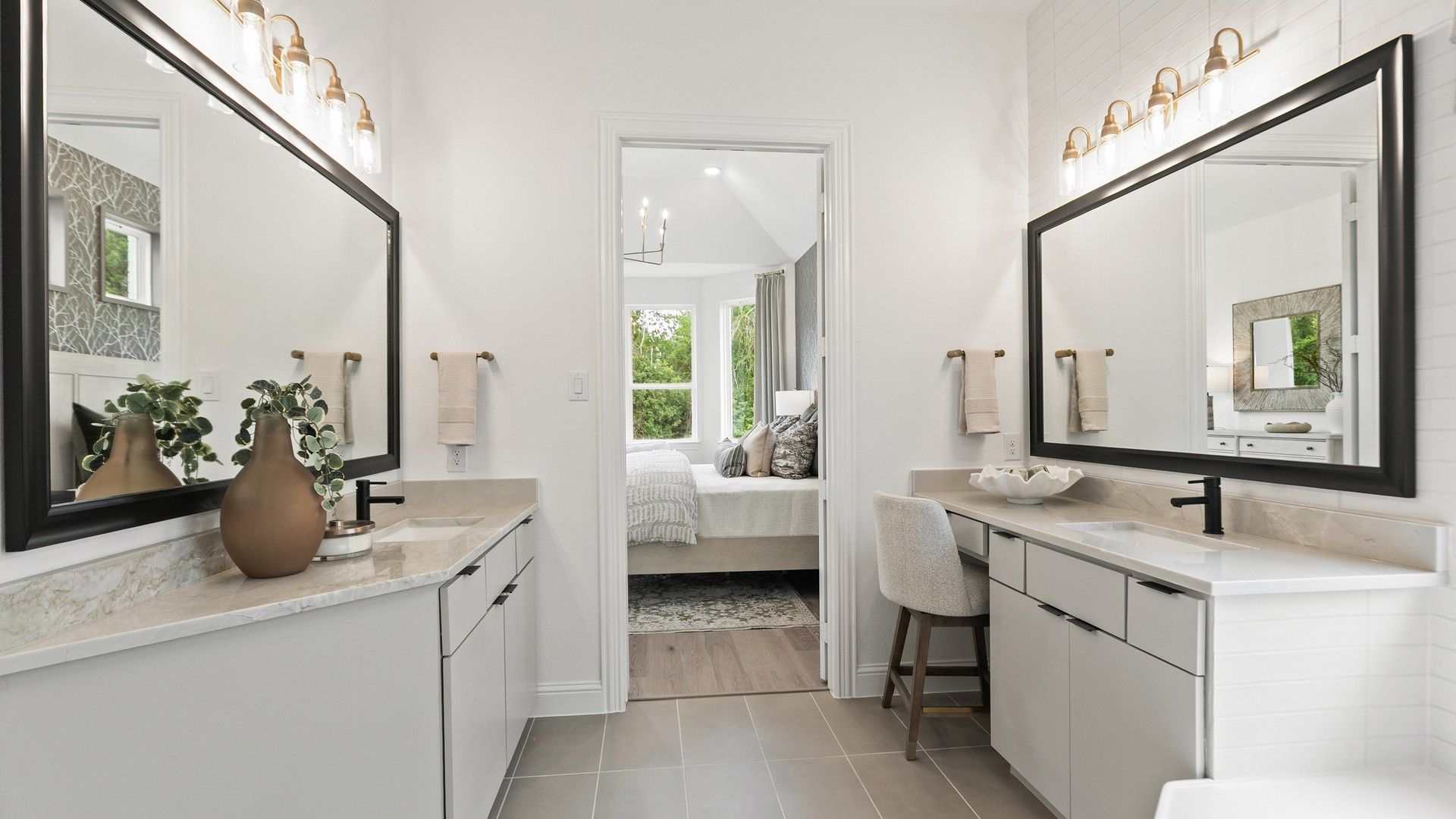 Experience sophistication with sleek vanities, exquisite lighting, and seamless bedroom transition in Katy Lakes.