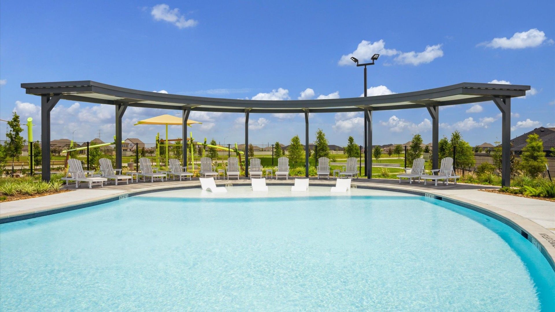Experience luxury at Westland Ranch with a stunning pool, curved pergola, and elegant lounge seating. Texas elegance.