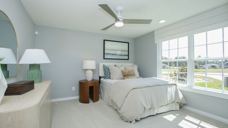 Experience serene elegance with expansive windows and chic décor in Cielo community's luxury home.