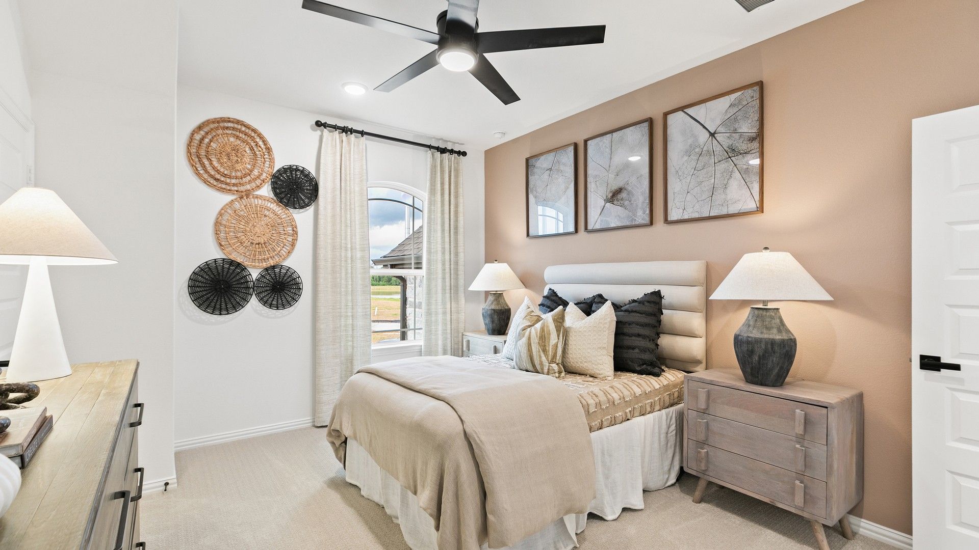 Experience serene elegance with plush bedding, exquisite lighting, and artistic decor in Katy Lakes' premier residences.