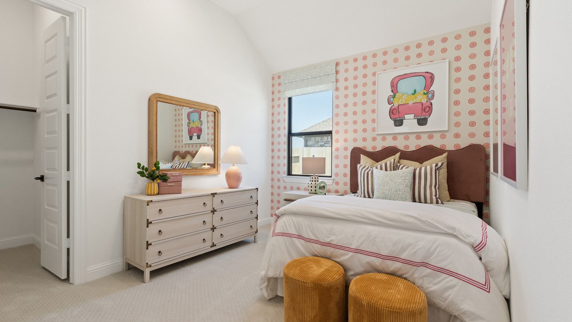 Oakwood Estates bedroom boasts polka dot wallpaper and designer decor that epitomize modern luxury.