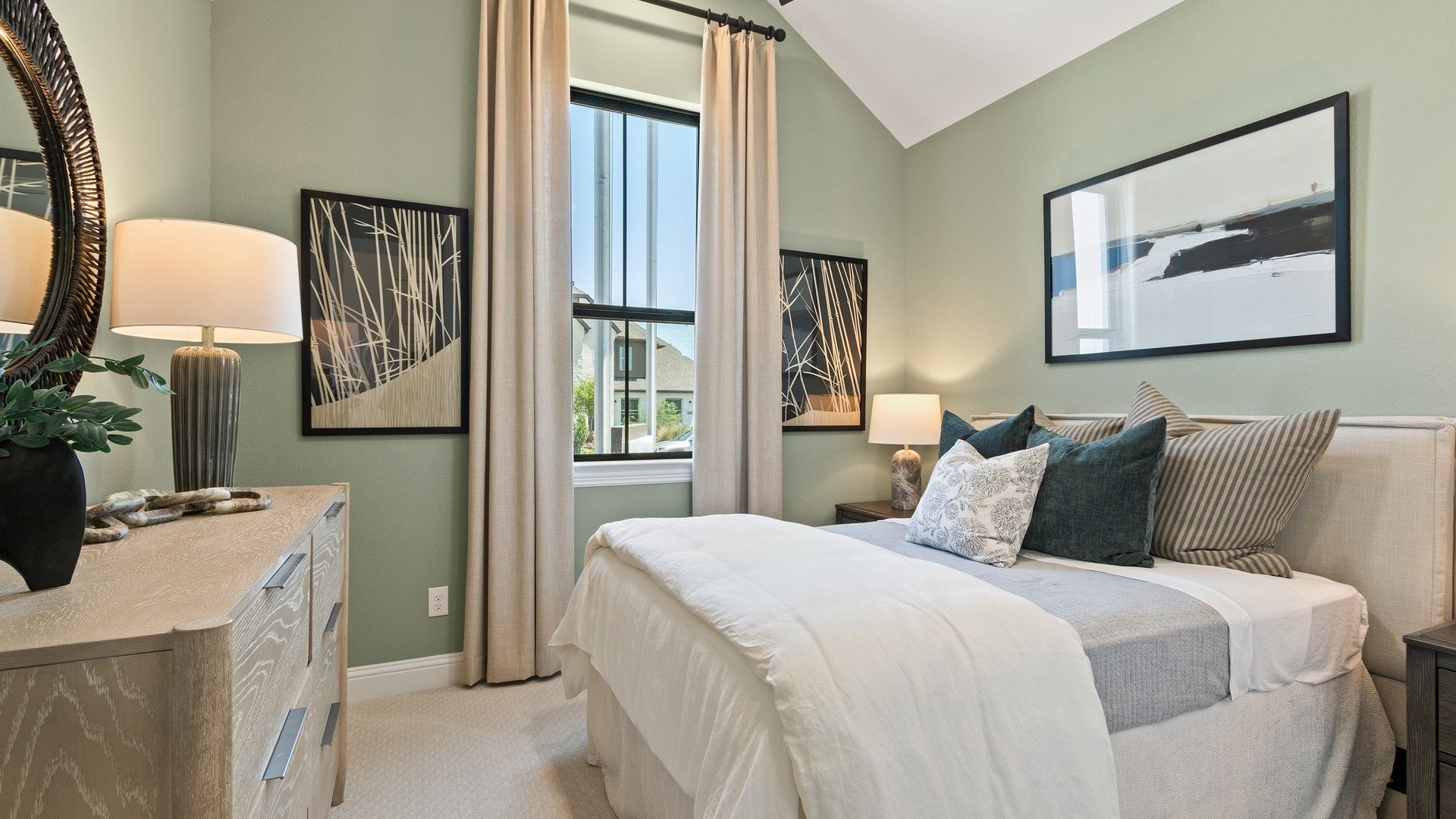 Experience elegance in Oakwood Estates. Vaulted ceiling, modern art, bespoke lighting.