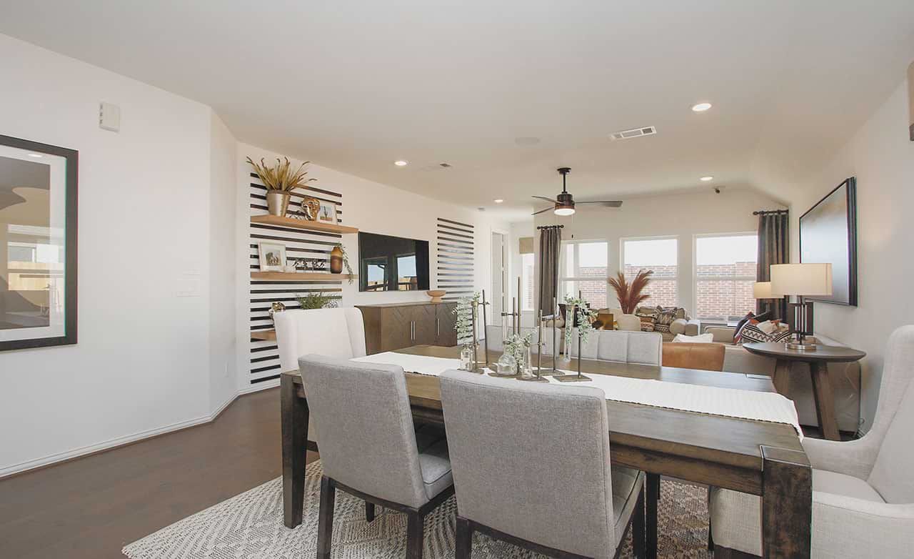 Experience refined elegance with open layout, striped wall accents, and hardwood floors in prestigious Cypress Green.