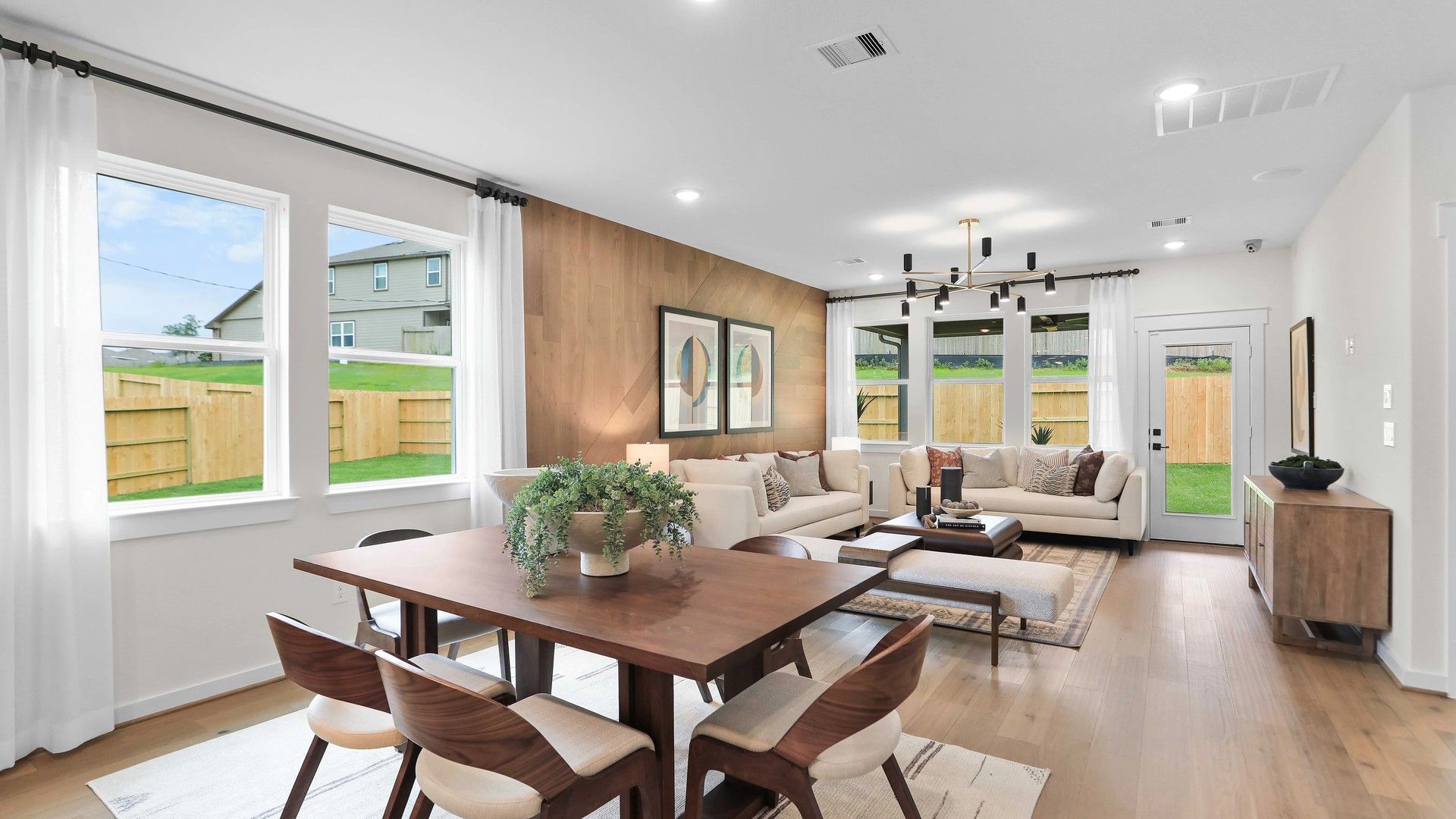 Luxurious wood accents and chic fixtures enhance this Mostyn Springs living room.
