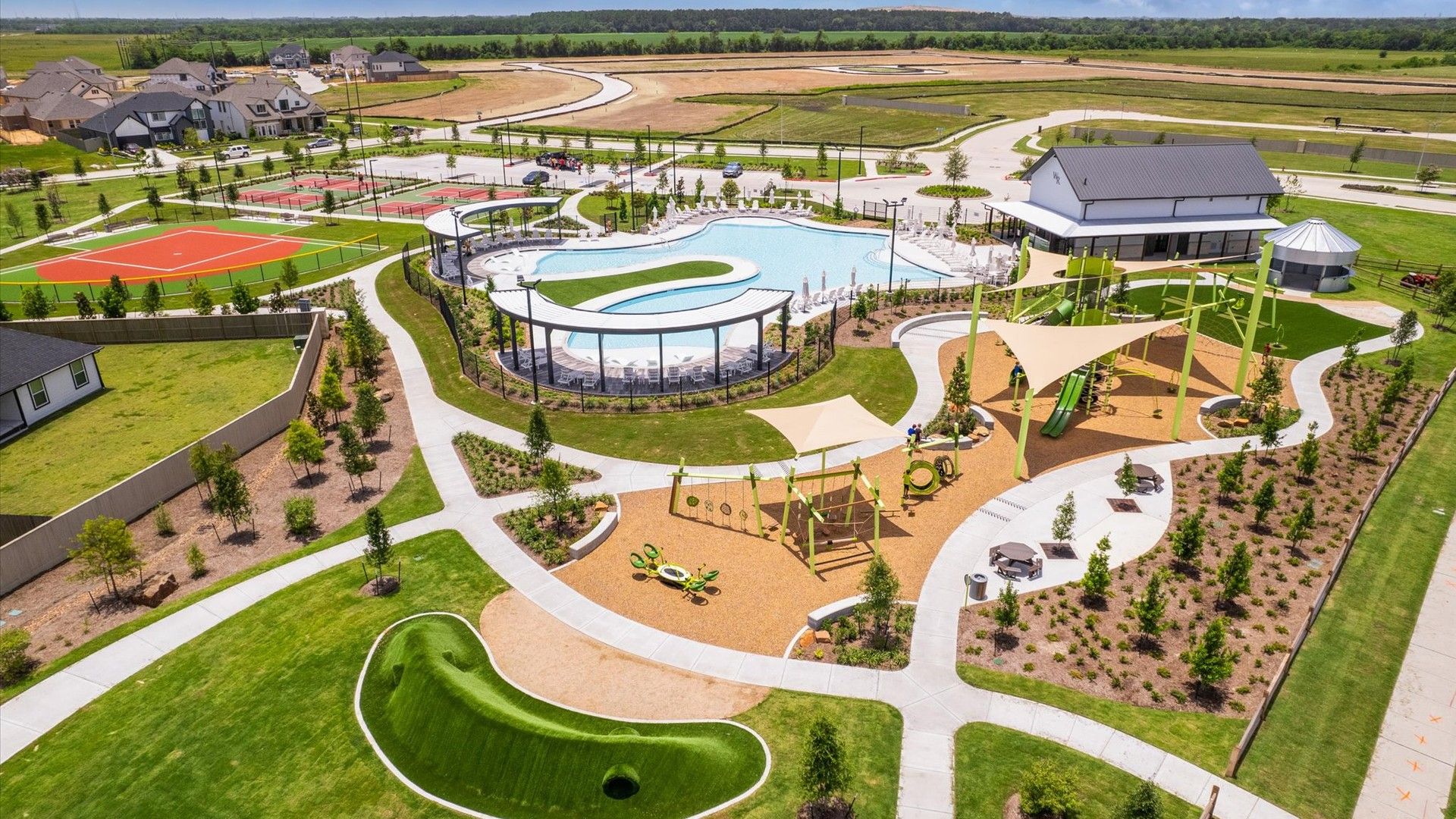 Experience luxury living at Westland Ranch with a modern pool, sports courts, and landscaped paths in tranquil Texas.