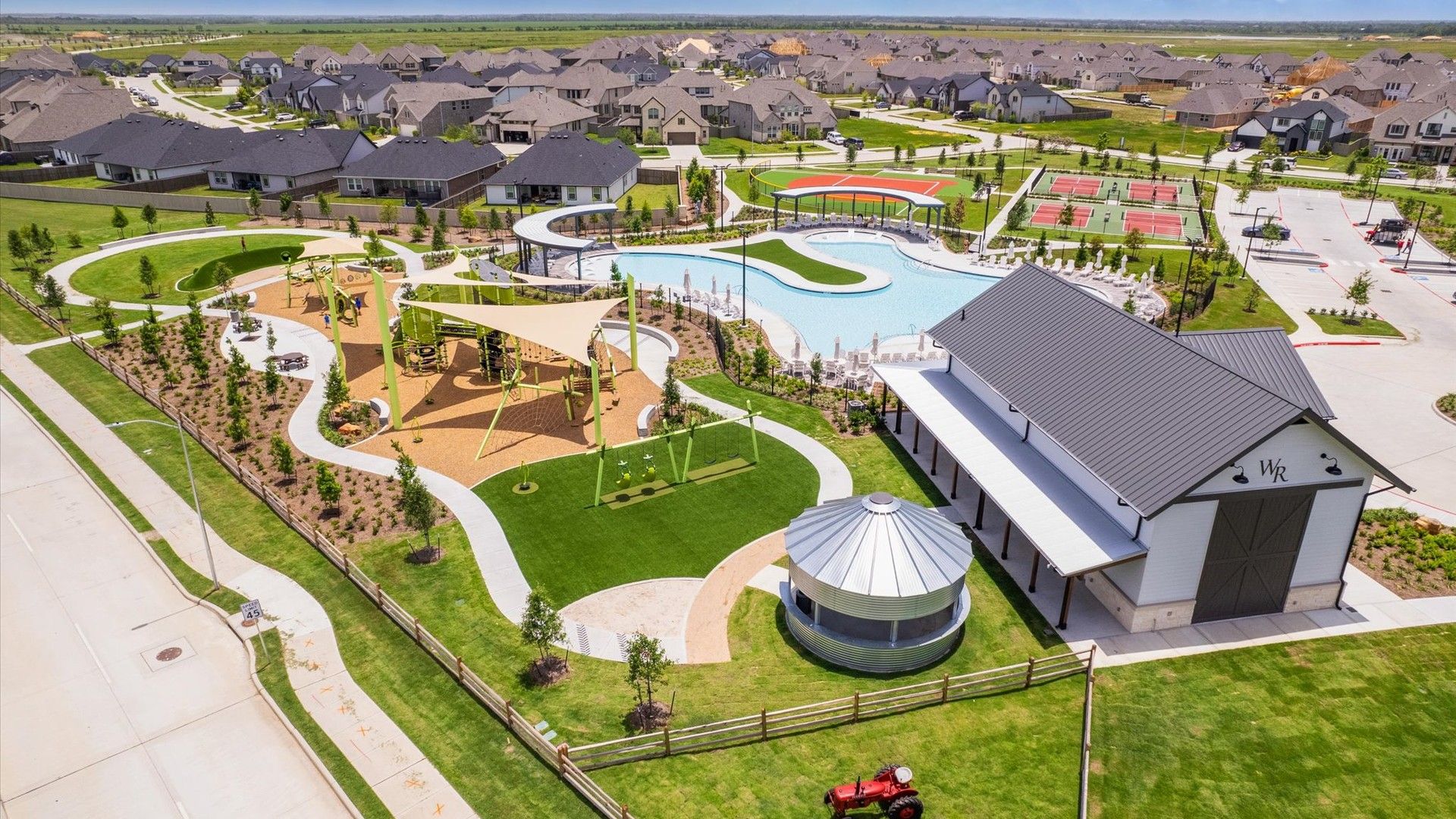 Westland Ranch offers a resort-style pool, modern playground, and sleek facilities amidst exquisite lush landscaping.