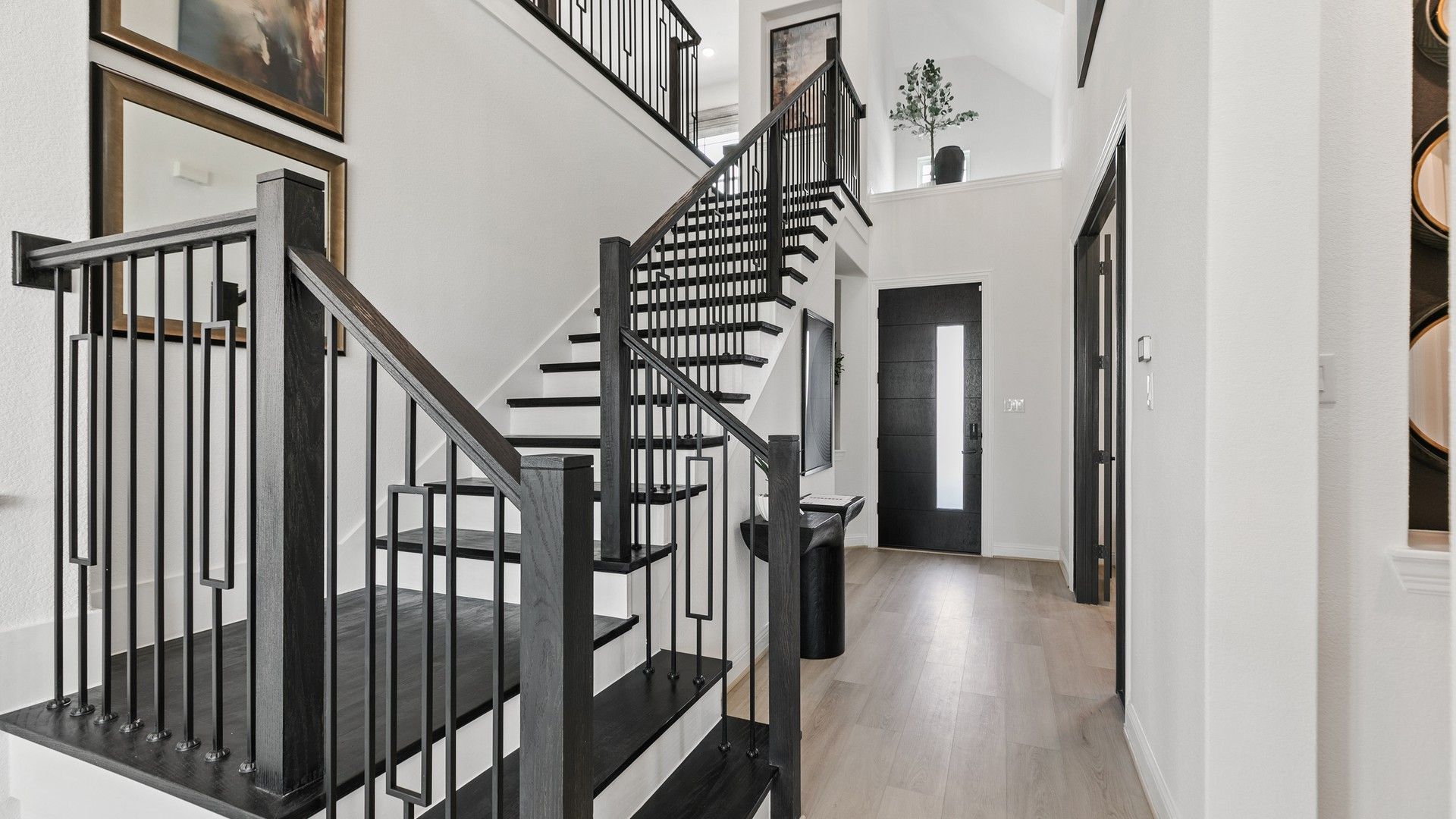 Experience refined elegance with sleek dark wood stairs and railings. Park at Eldridge.