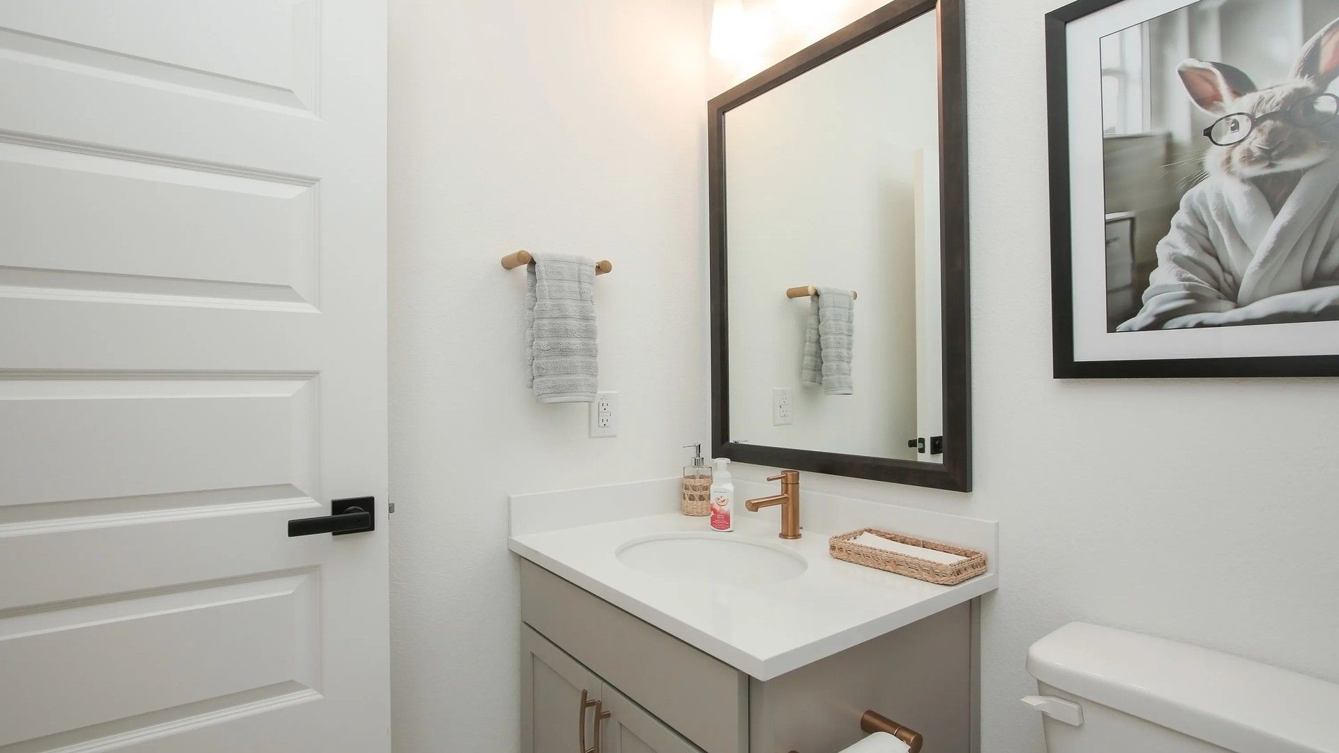 Sophisticated Ellis Cove bathroom with a quartz countertop, chic fixtures, and soothing neutral tones.