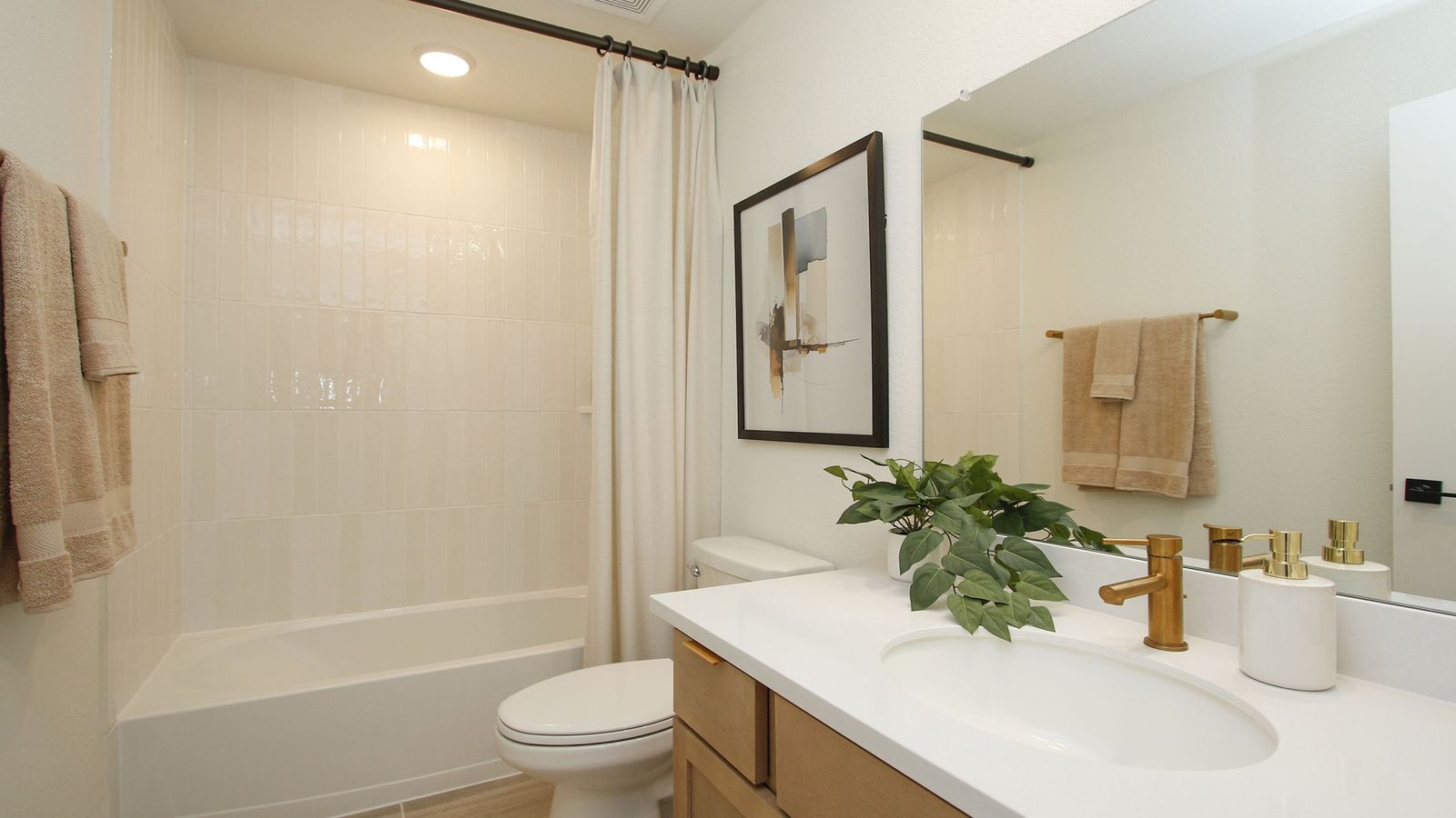 Immerse in luxury with sleek gold fixtures, refined wood accents, and contemporary design in Cielo.