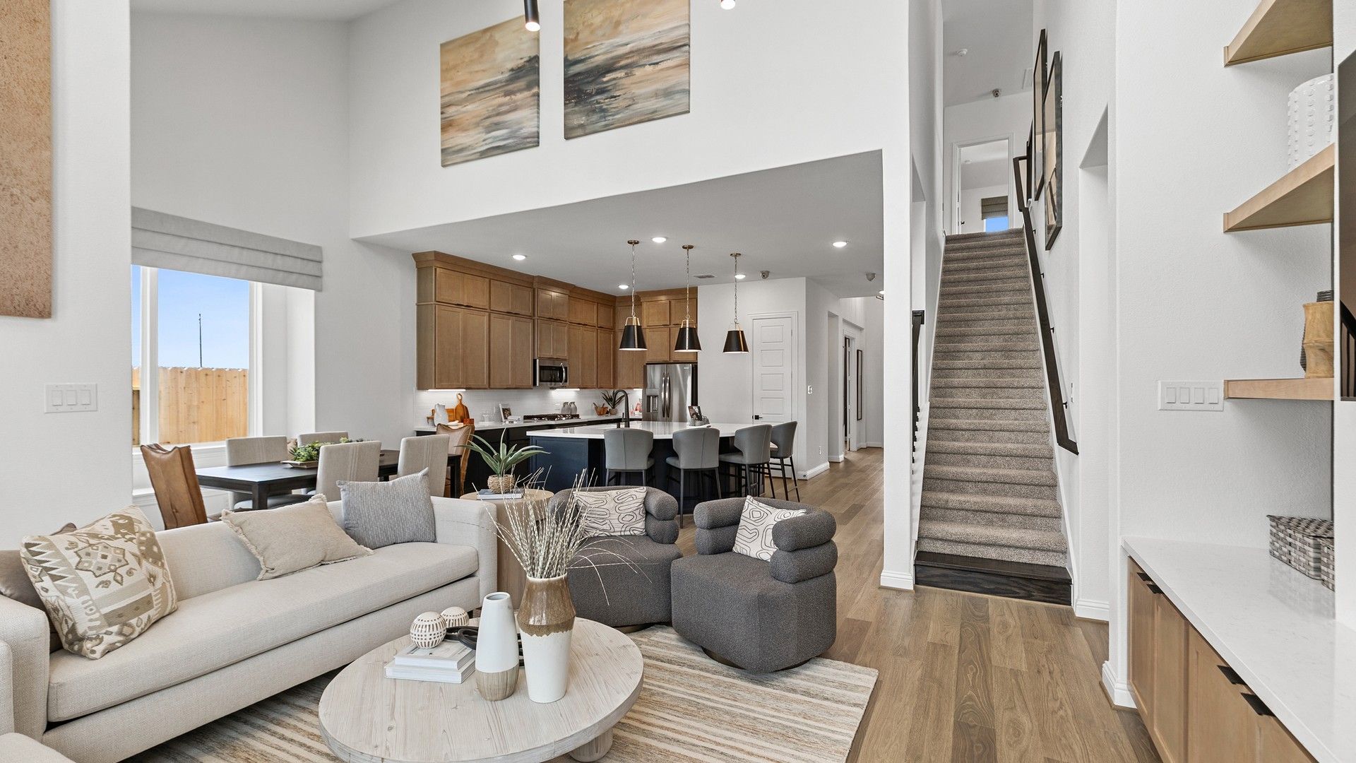 Luxurious open-concept design boasting high ceilings and upscale finishes in Beamer Villas, Texas.