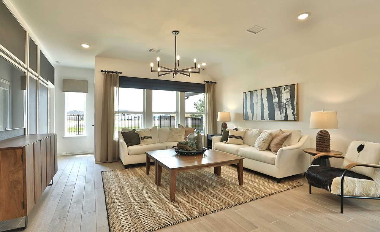 Exquisite wood flooring and chic furnishings adorn this Bridgeland living room.