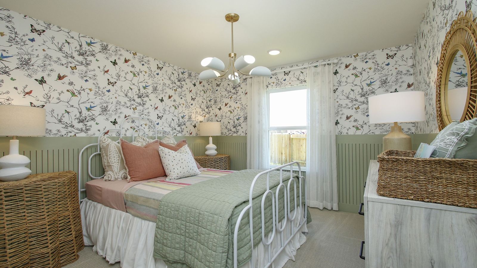 Exquisite floral wallpaper complemented by wicker accents exemplifies luxury in Cielo's bedroom design.