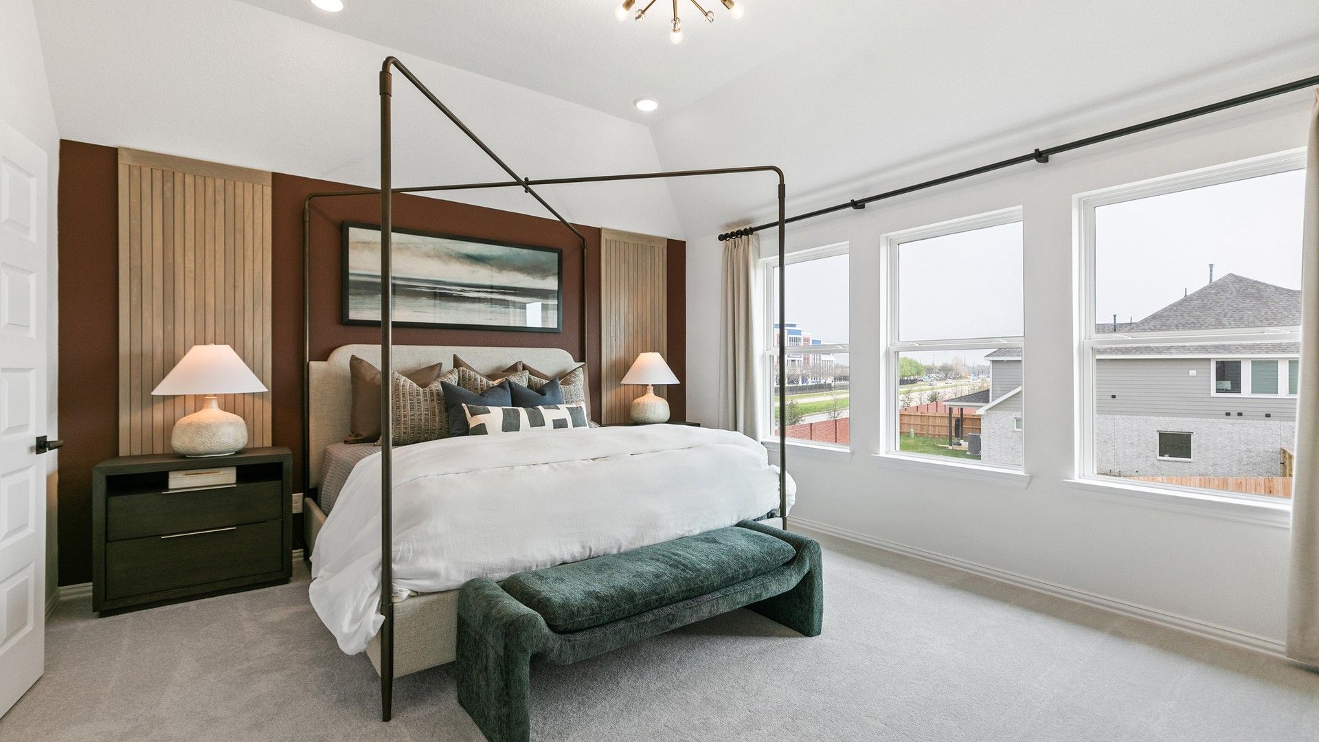 Luxurious bedroom with panoramic windows and bespoke wood accents, highlighting refined modern design in Eldridge.