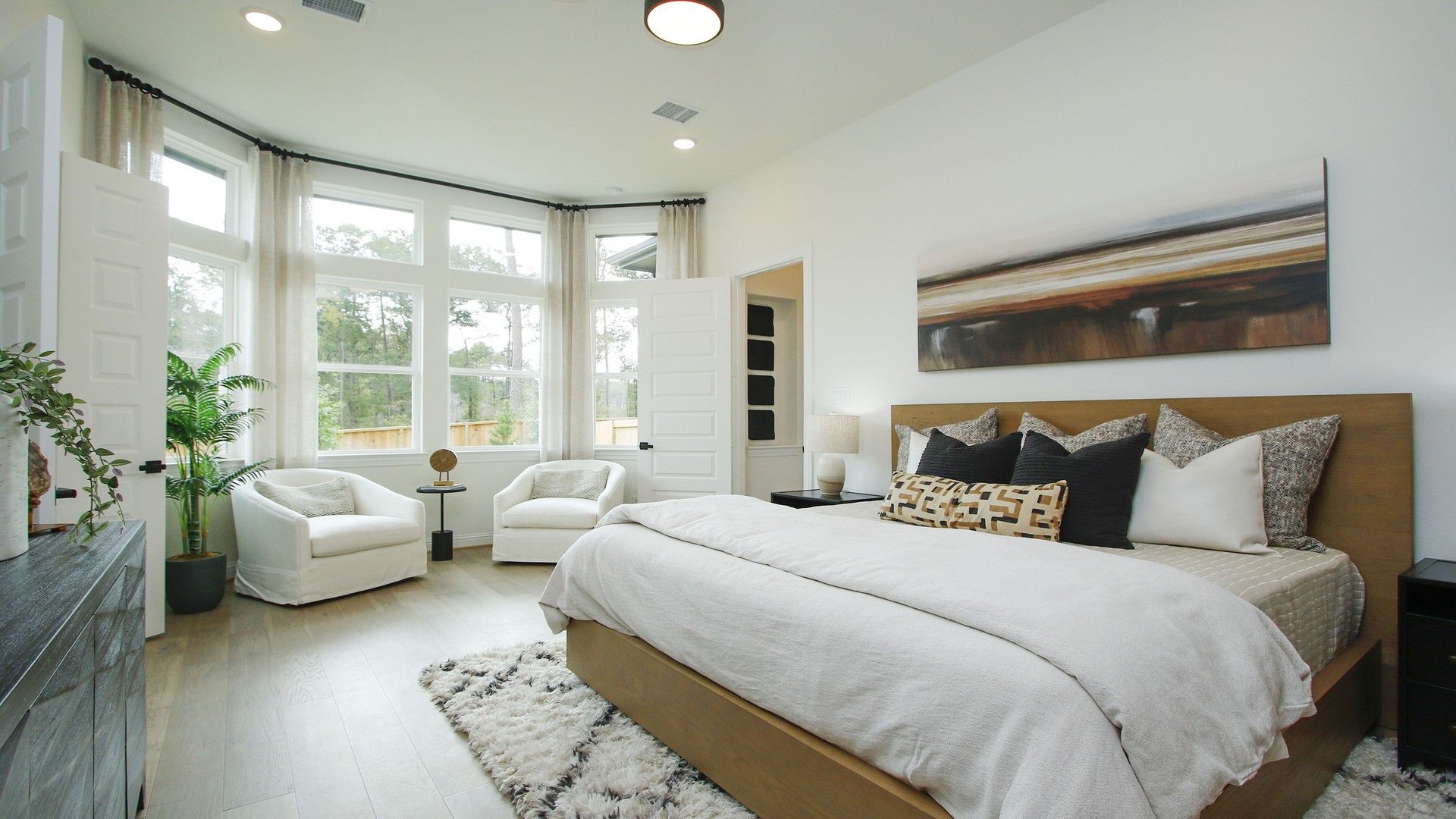 Discover expansive bay windows and sophisticated decor in this Woodlands Hills sanctuary.