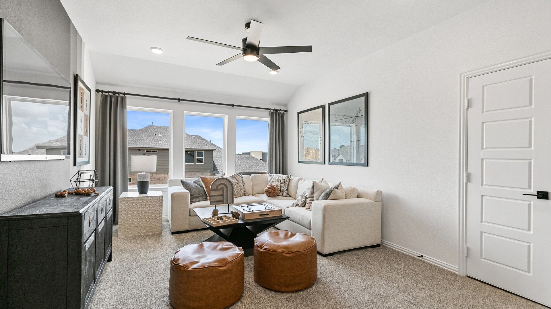 Elegant living room with expansive windows and plush seating in Beamer Villas.