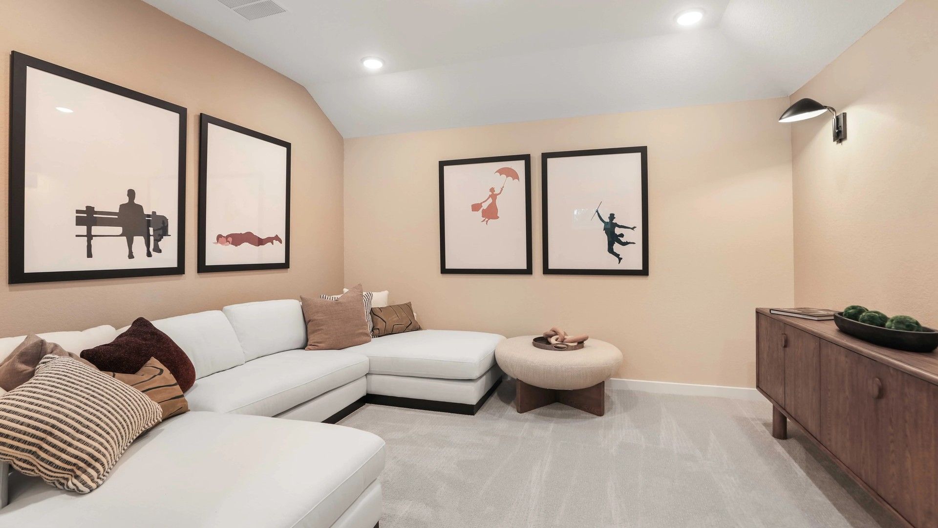 Elegant living space with white sectional and custom art in Mostyn Springs.