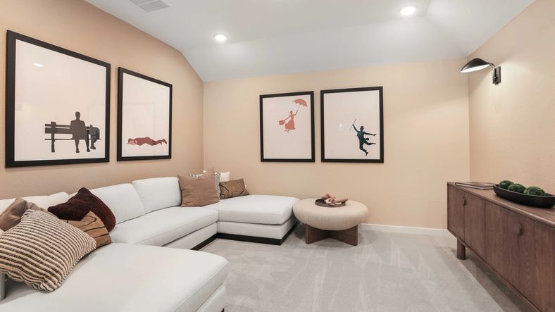 Elegant living space with white sectional and custom art in Mostyn Springs.