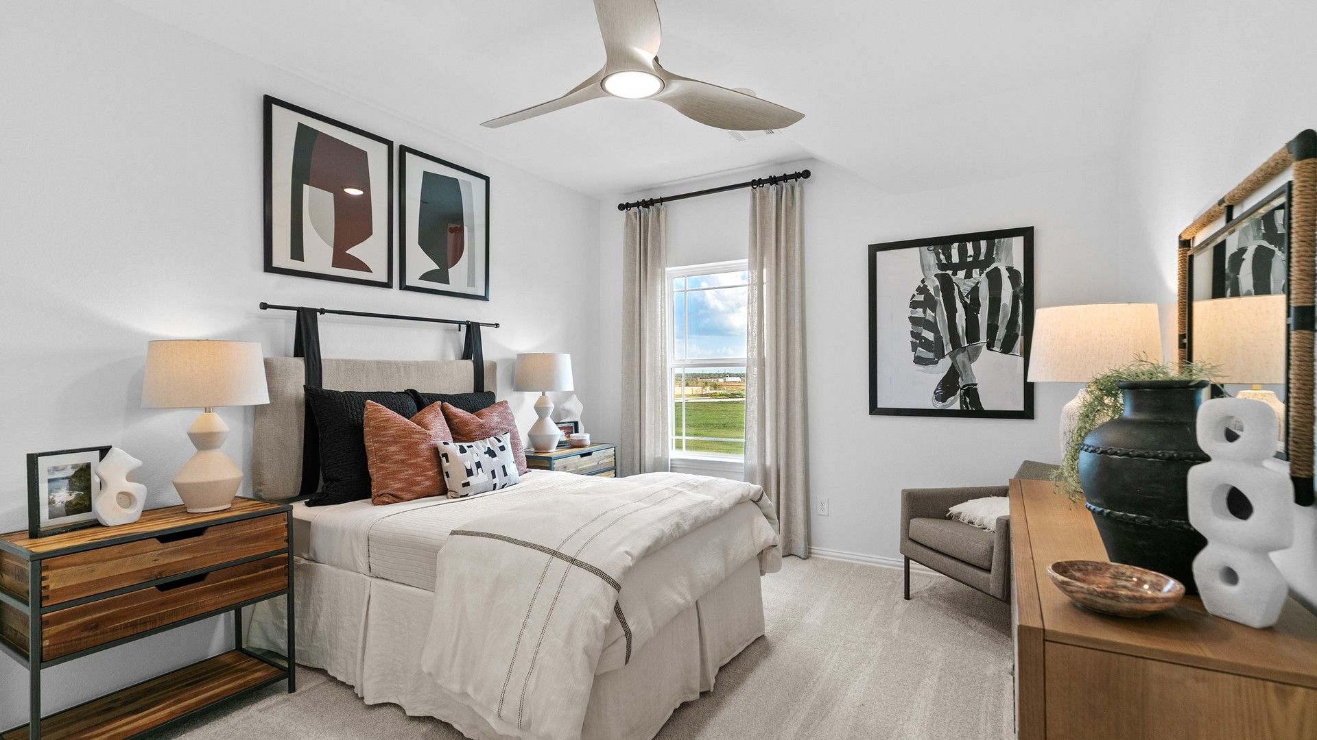 River Ranch bedroom exudes elegance with minimalist decor, modern art, and expansive scenic window views.