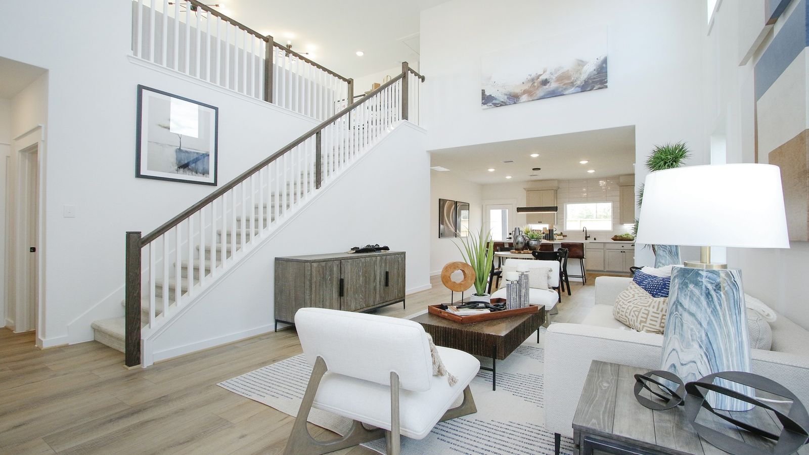 High ceilings, open staircase, and chic modern decor define luxury living in Pinehurst.
