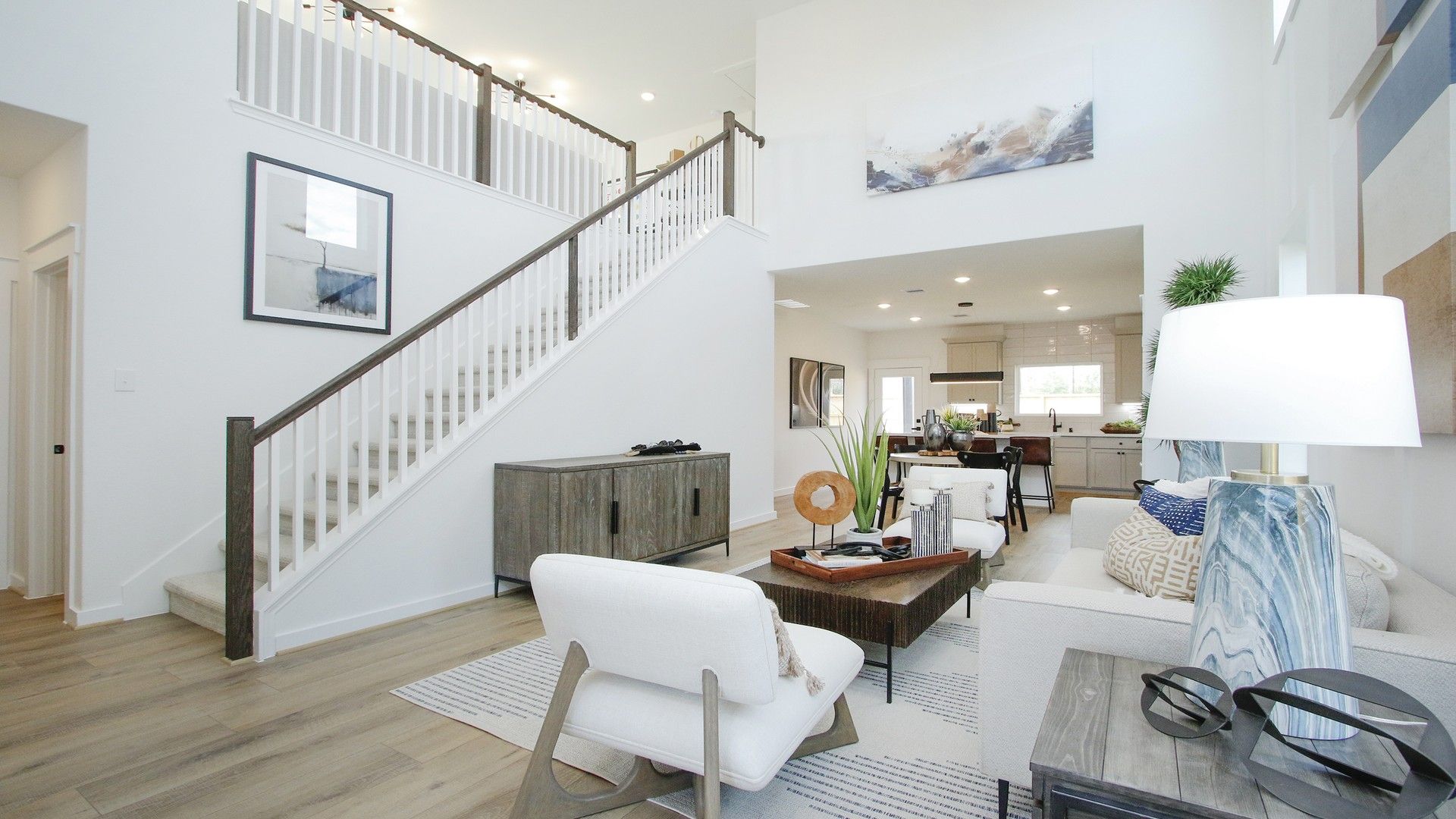 High ceilings, open staircase, and chic modern decor define luxury living in Pinehurst.