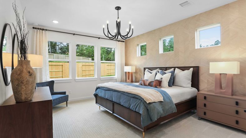 The Mostyn Springs bedroom features designer lighting, custom paneling, and serene views, epitomizing luxury living.