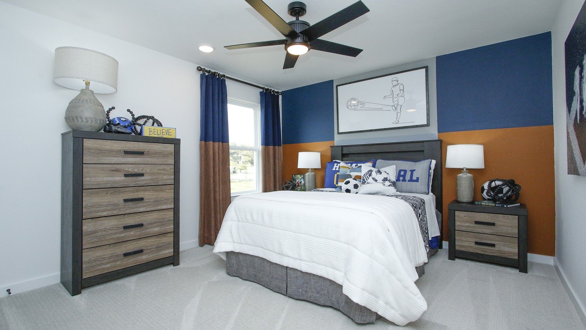 Dual-tone walls and sleek furniture enhance this contemporary bedroom in Pinehurst.