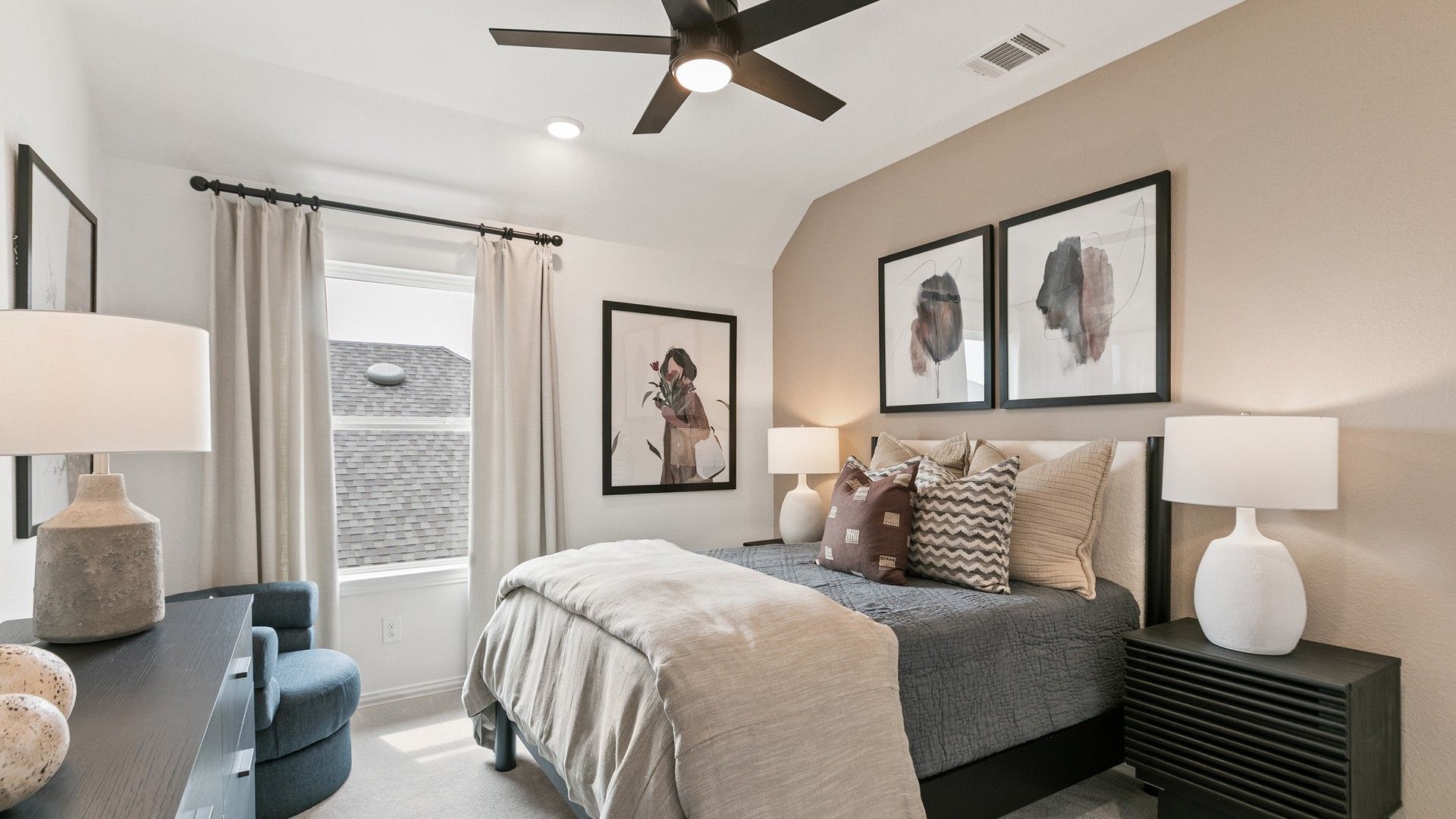 Luxurious bedroom with beige accent wall and plush textiles in Park at Eldridge's exclusive community.
